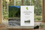 Acrylic plaque with nature-themed design and text on a wooden surface