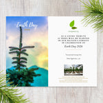 Earth Day 2026 card with tree and nature-themed design on a wooden surface.